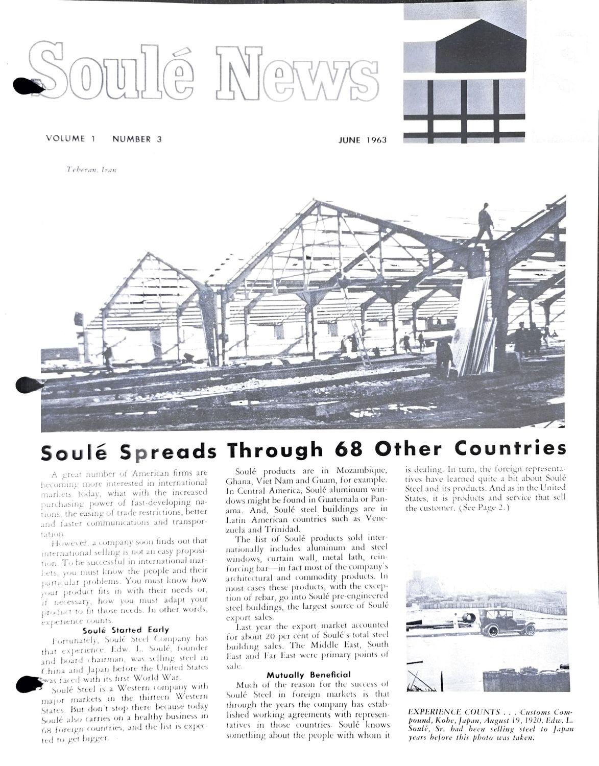 Black-and-white photo of a steel frame structure under construction with workers on the beams.