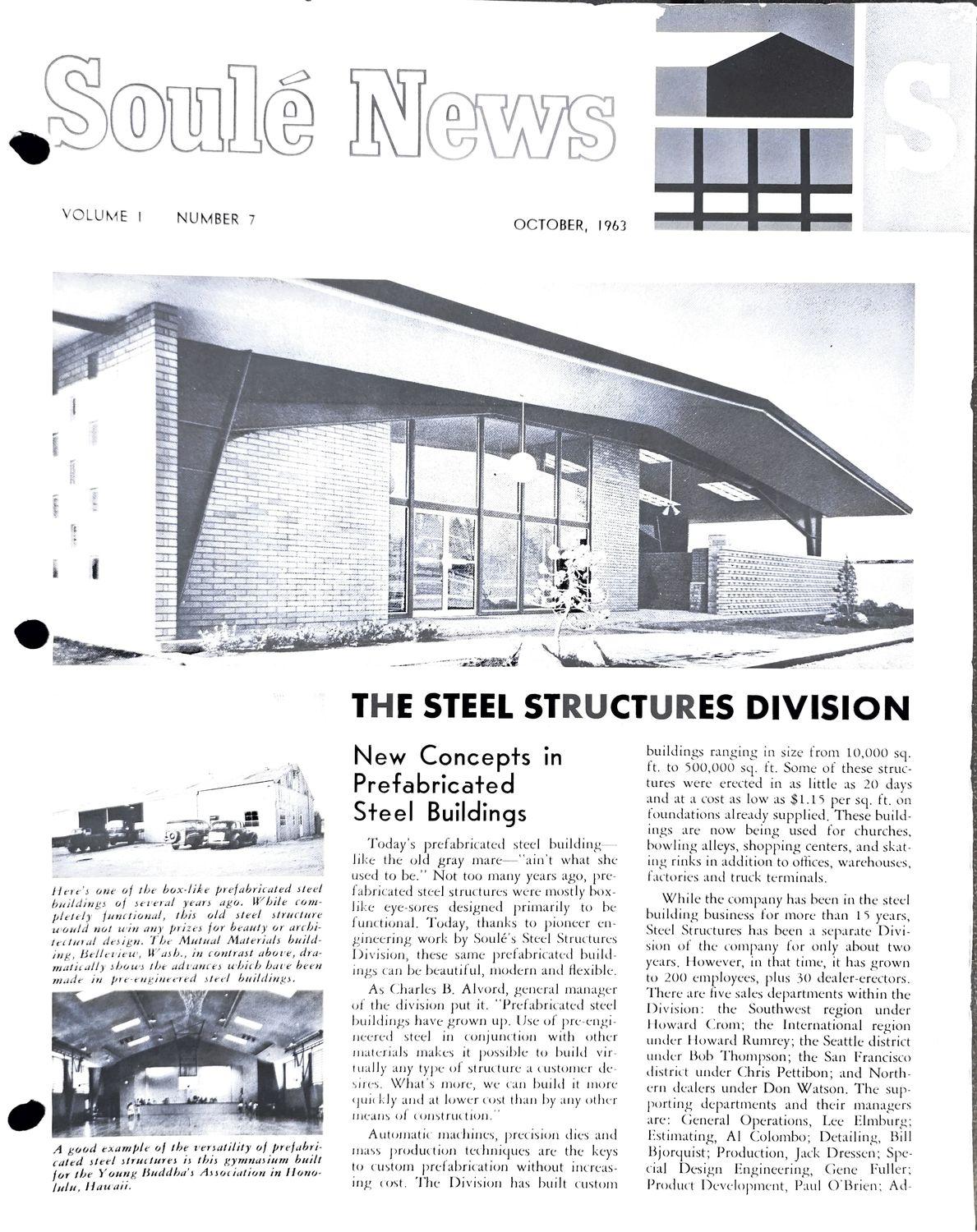 Black and white photo of a modern building with a slanted roof and large windows.